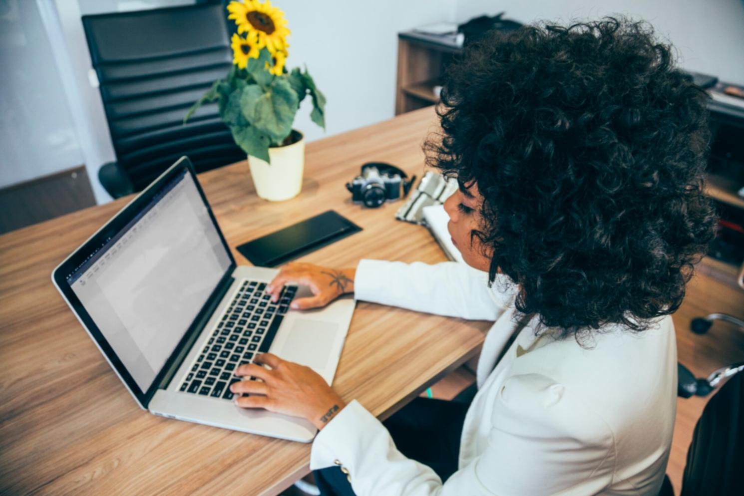 Family budget planning session with documents spread on kitchen table