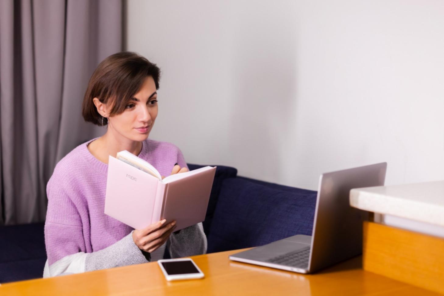 Professional financial consultation workspace showing organized documents and budgeting materials